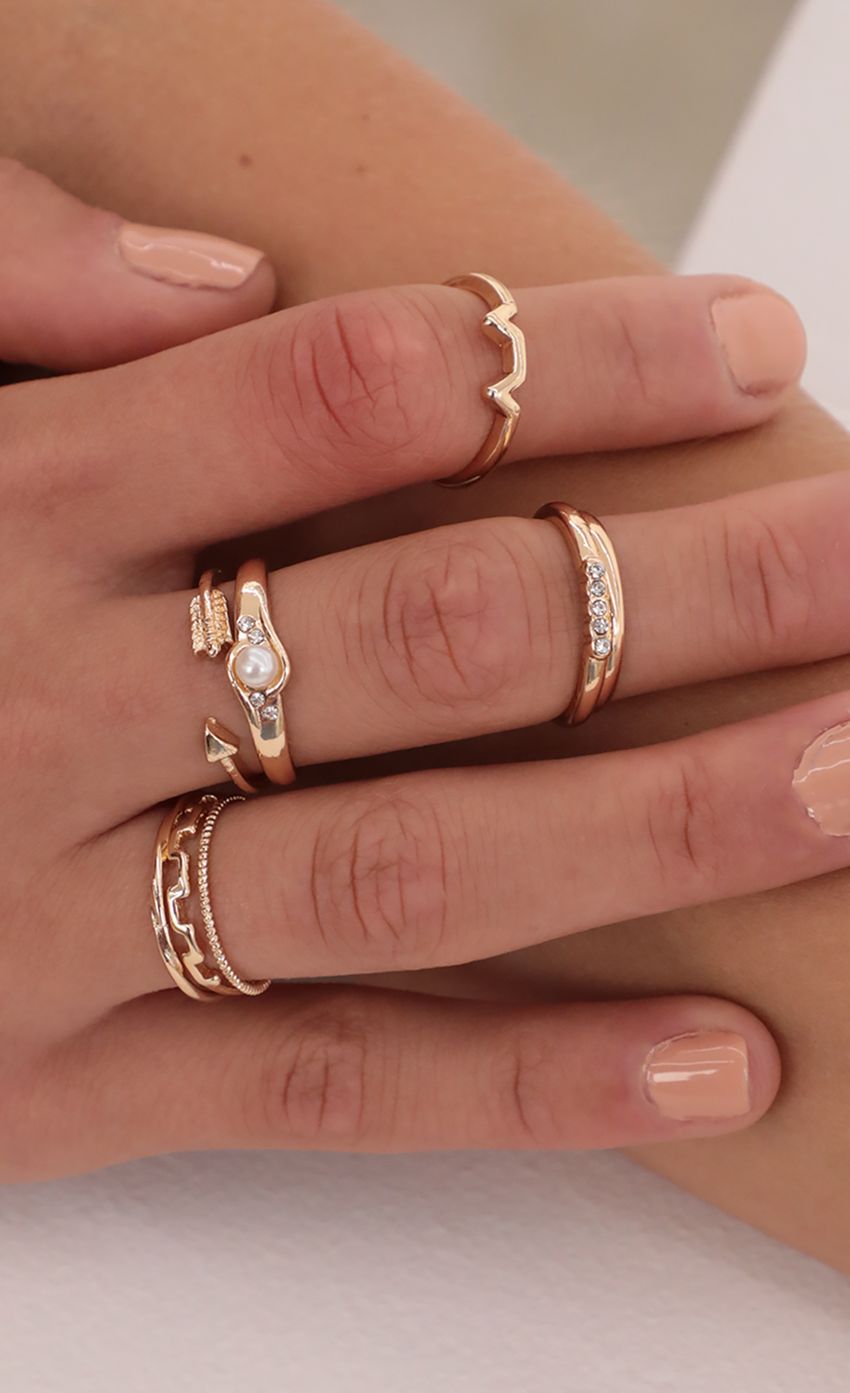 Picture Arrow and Pearl Ring Set in Gold. Source: https://media-img.lucyinthesky.com/data/May21_2/850xAUTO/AT2A6250.JPG
