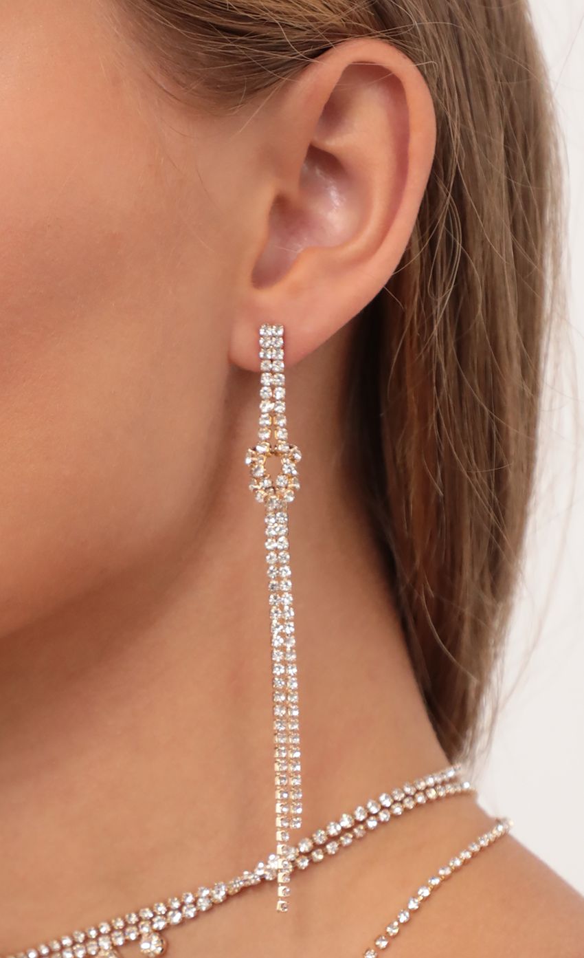 Picture Double Drop Knot Crystal Earrings in Gold. Source: https://media-img.lucyinthesky.com/data/May21_2/850xAUTO/AT2A6394.JPG