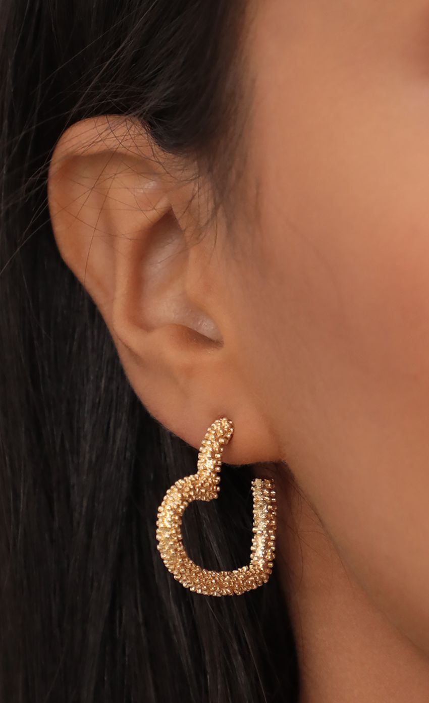 Picture Petite Golden Heart Earrings. Source: https://media-img.lucyinthesky.com/data/May21_2/850xAUTO/AT2A7252.JPG