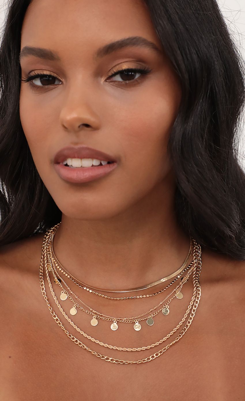 Picture Trendy Multi Chain Gold Necklace Set. Source: https://media-img.lucyinthesky.com/data/May21_2/850xAUTO/AT2A7388.JPG