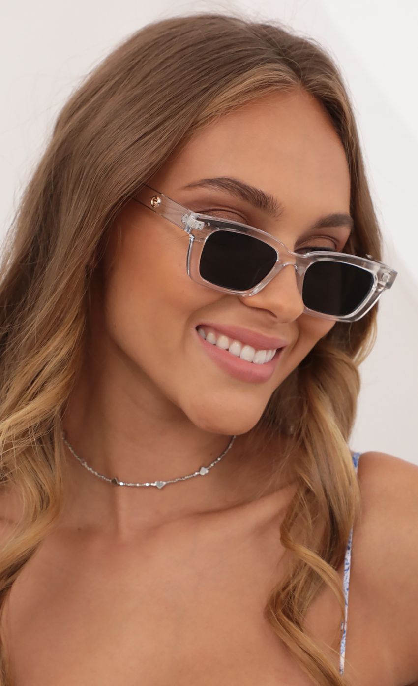 Picture Henrietta Classic Sunglasses in Clear. Source: https://media-img.lucyinthesky.com/data/May21_2/850xAUTO/AT2A7994.JPG