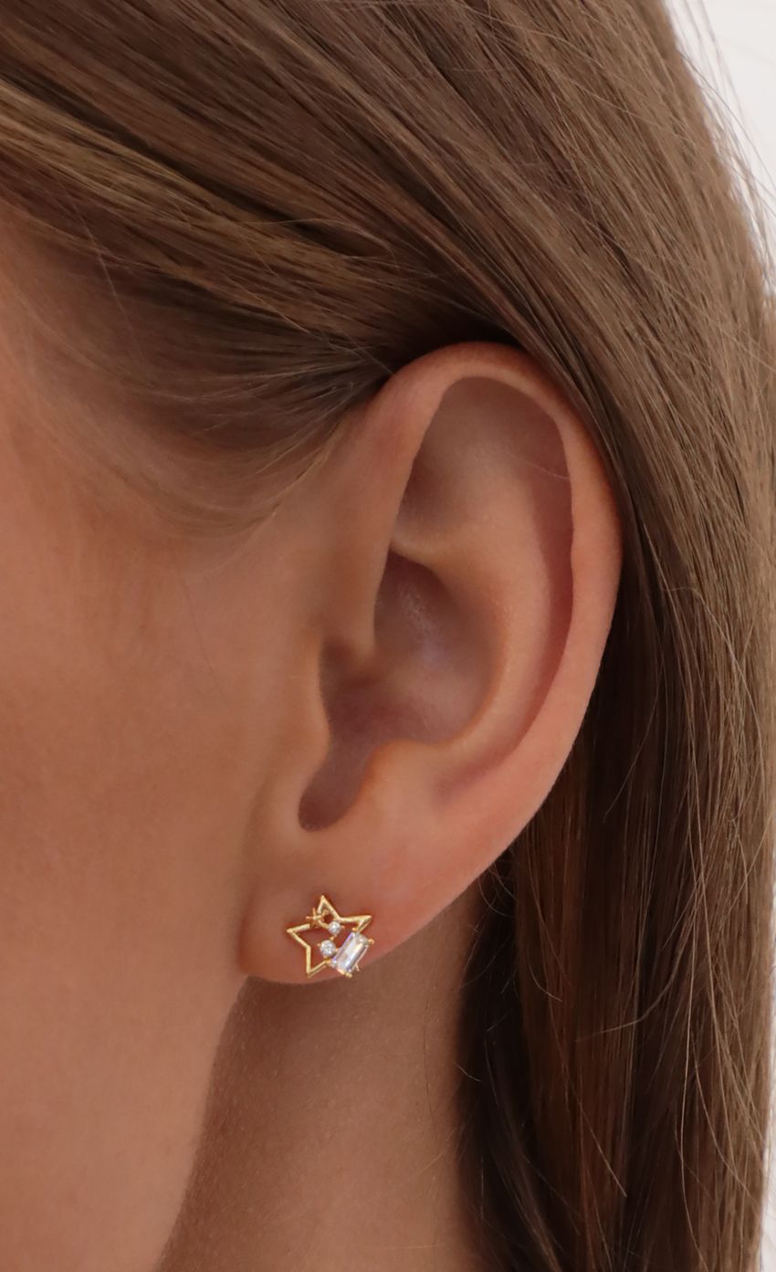 Picture Open Star Stud Earrings in Gold. Source: https://media-img.lucyinthesky.com/data/May21_2/850xAUTO/AT2A8272.JPG
