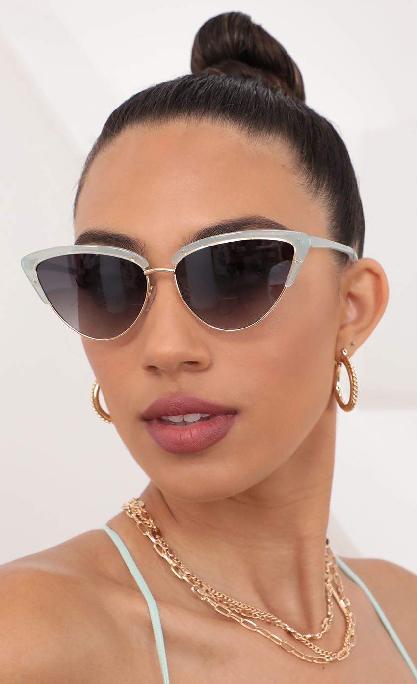 Picture Hollywood Cat-Eye Sunglasses in Clear Aqua. Source: https://media-img.lucyinthesky.com/data/May21_2/850xAUTO/AT2A9061.JPG