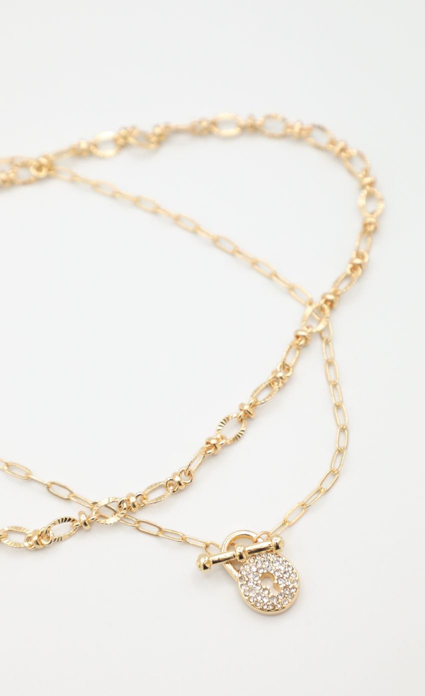 Picture Throw The Key Away Necklace in Gold. Source: https://media-img.lucyinthesky.com/data/May22_1/850xAUTO/1J7A0039.JPG