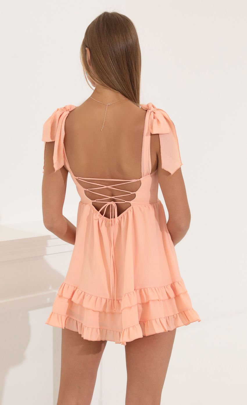 Picture Flare Dress in Peach. Source: https://media-img.lucyinthesky.com/data/May22_1/850xAUTO/1V9A4768.JPG