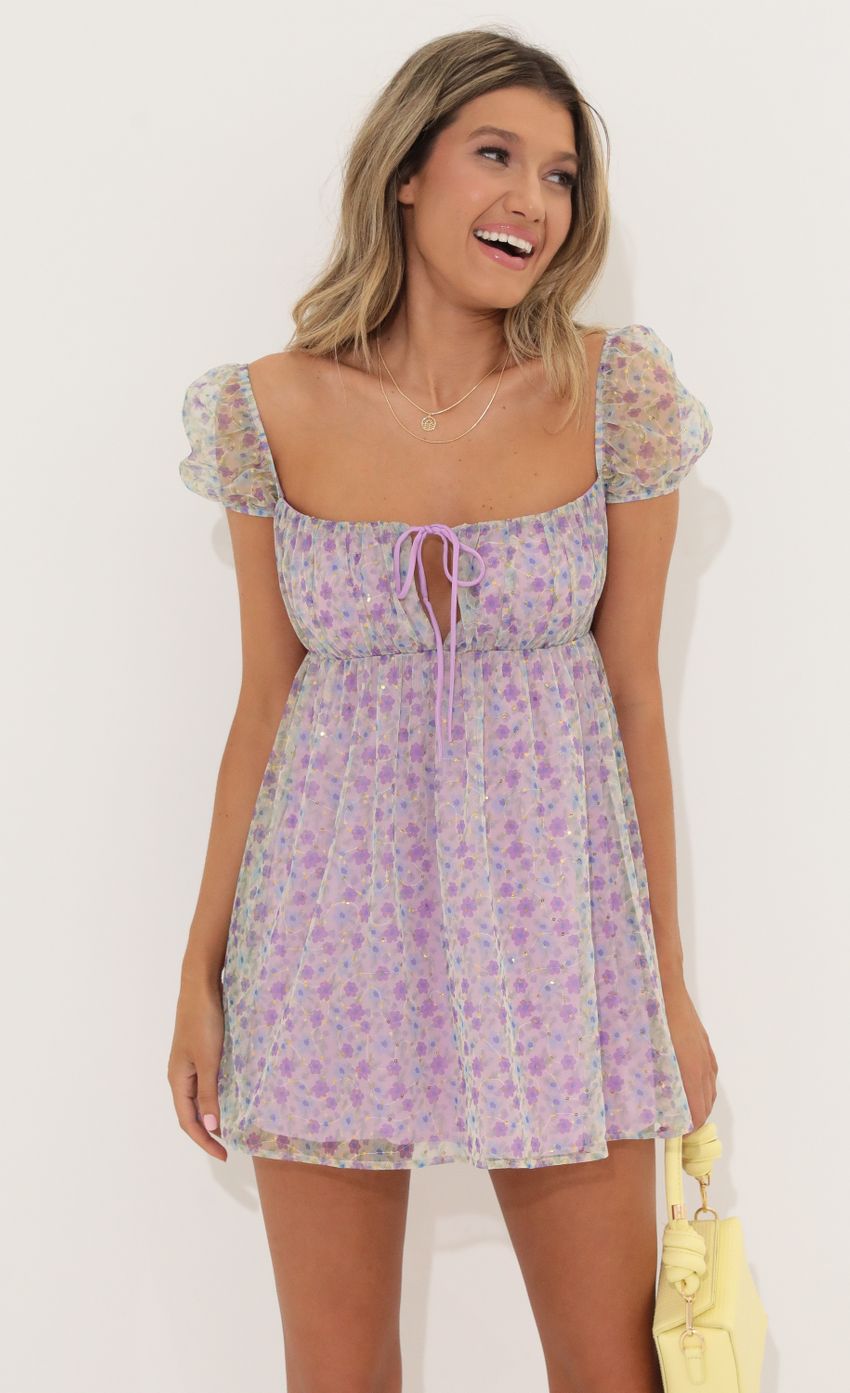Picture Sequin Baby Doll Dress in Purple Floral. Source: https://media-img.lucyinthesky.com/data/May22_1/850xAUTO/1V9A61621.JPG