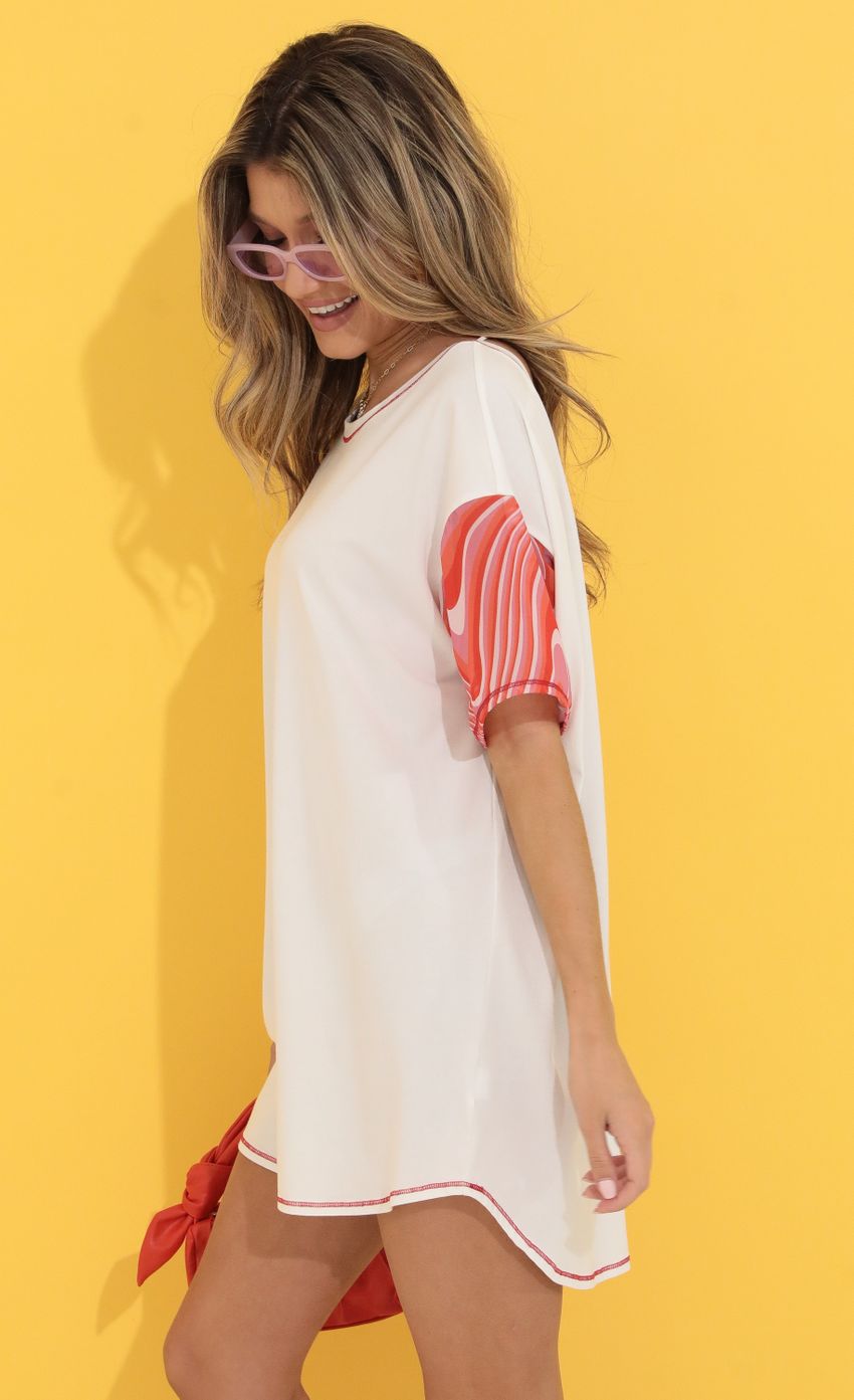 Picture Shirt Dress in White and Red Swirl. Source: https://media-img.lucyinthesky.com/data/May22_1/850xAUTO/1V9A9263.JPG
