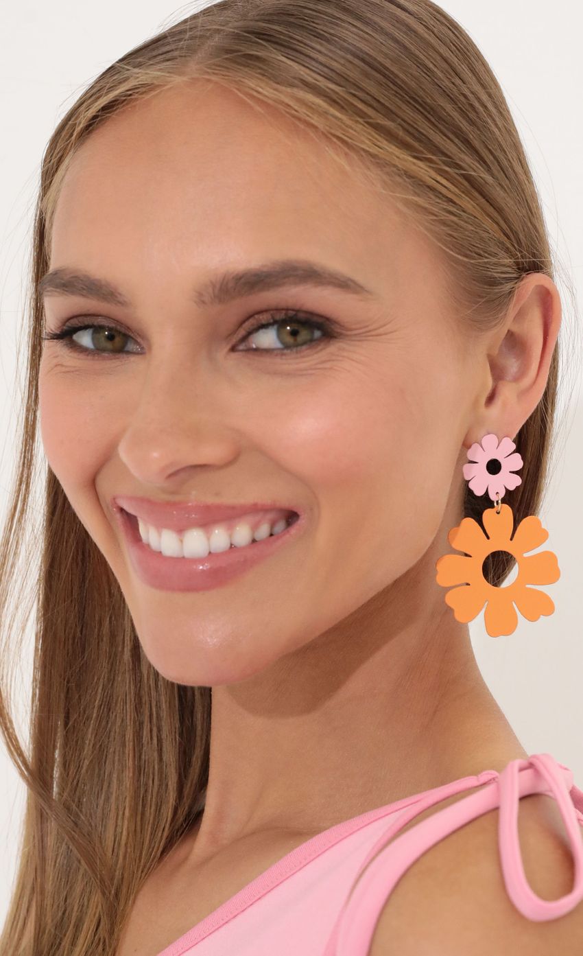 Picture In The Mood To Groove Earring in Orange. Source: https://media-img.lucyinthesky.com/data/May22_1/850xAUTO/2V9A1614.JPG