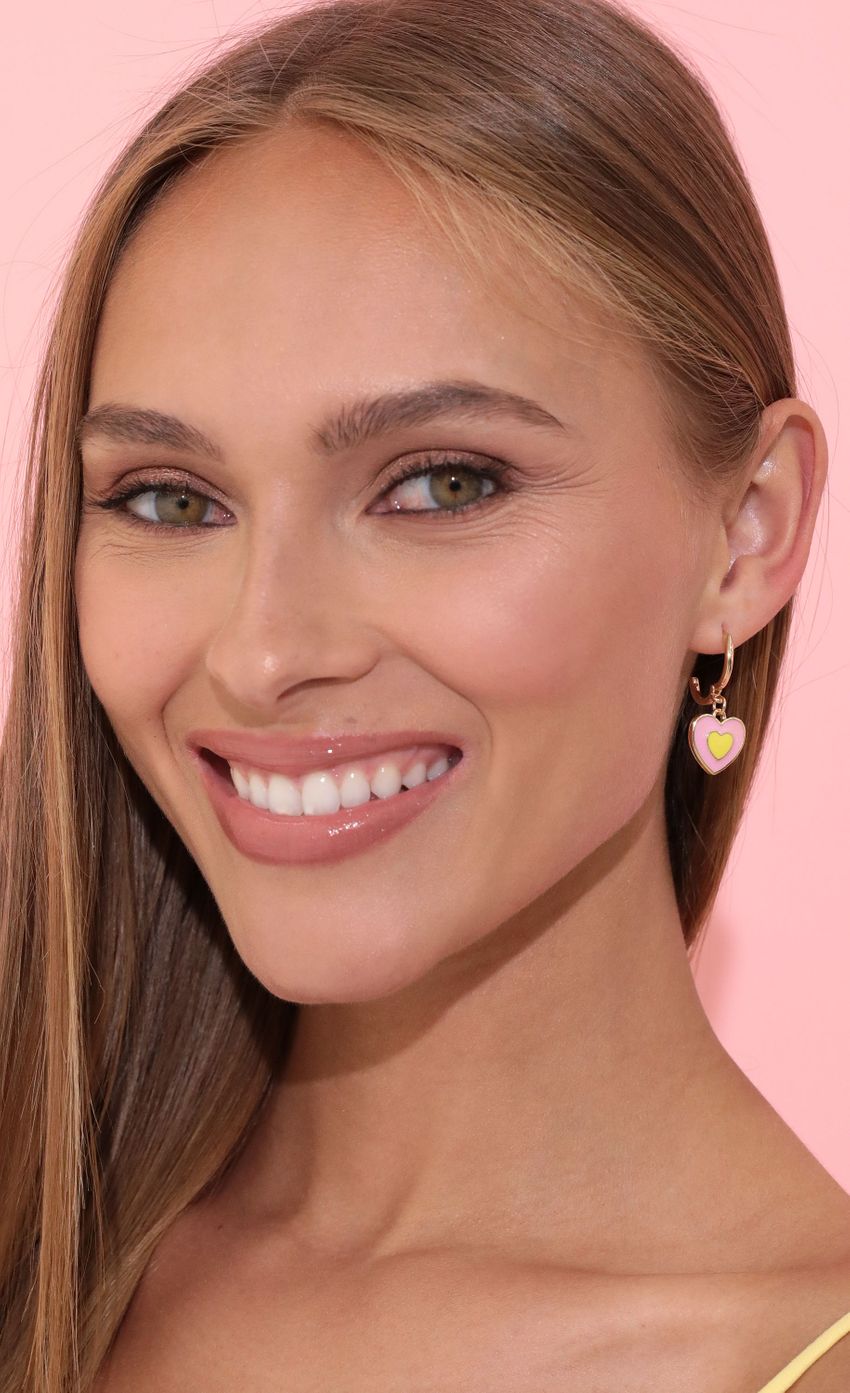 Picture Power Of Love Earring in Pink. Source: https://media-img.lucyinthesky.com/data/May22_1/850xAUTO/2V9A3526.JPG