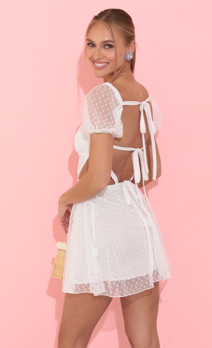 Picture Fit and Flare Dress in White Hearts. Source: https://media-img.lucyinthesky.com/data/May22_2/850xAUTO/1V9A0320.JPG