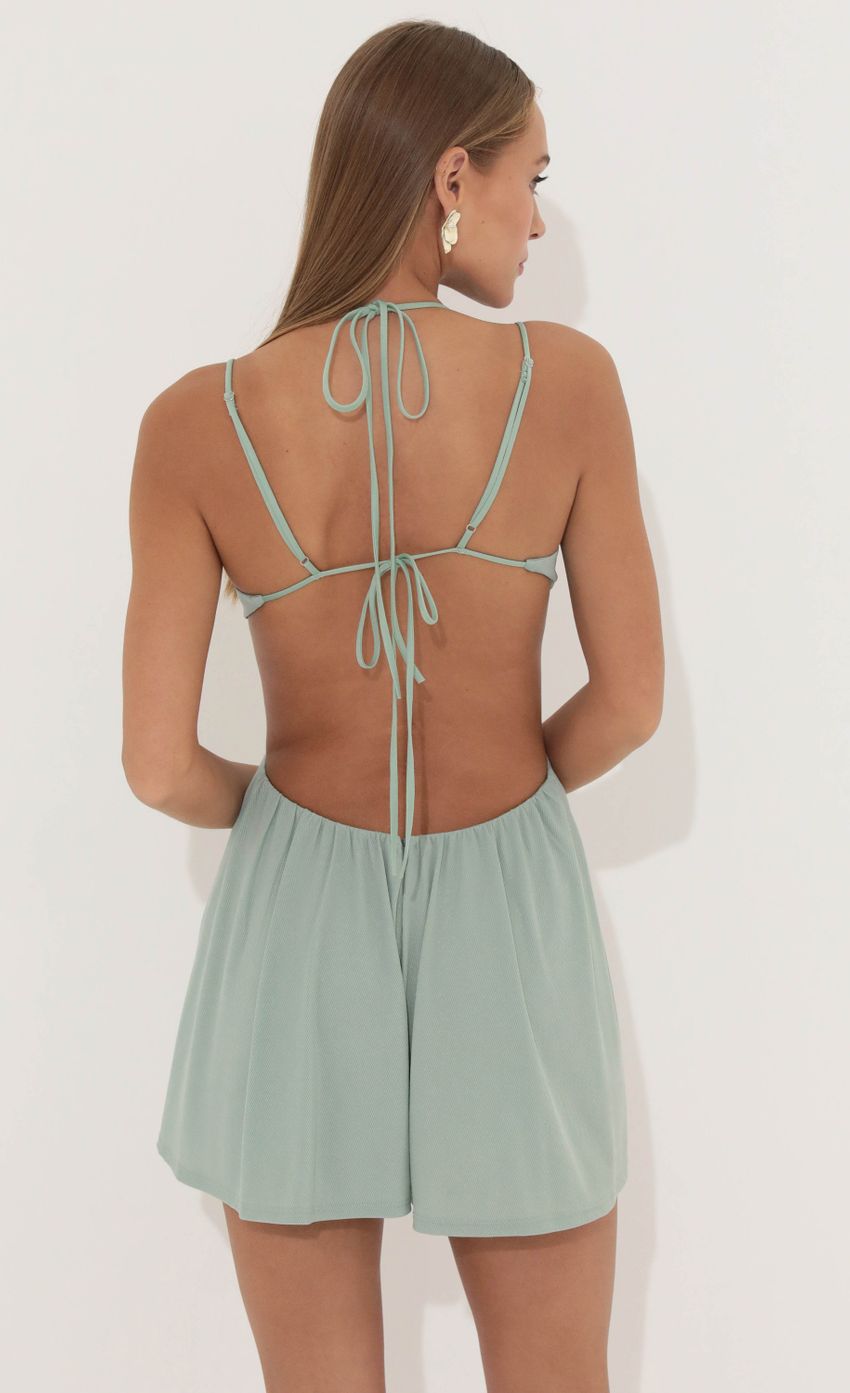 Picture Cutout Romper in Green. Source: https://media-img.lucyinthesky.com/data/May22_2/850xAUTO/1V9A1752.JPG