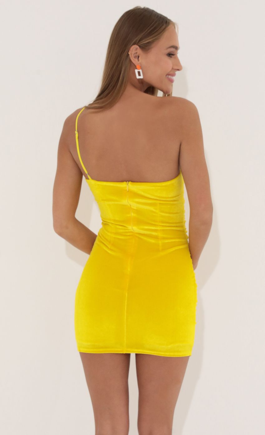 Picture One Shoulder Velvet Dress in Yellow. Source: https://media-img.lucyinthesky.com/data/May22_2/850xAUTO/1V9A64261.JPG