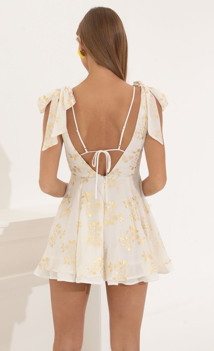 Picture Chiffon Fit and Flare Dress in Gold Foil. Source: https://media-img.lucyinthesky.com/data/May22_2/850xAUTO/1V9A6708.JPG