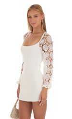 Picture Floral Crochet Long Sleeve Dress in White. Source: https://media-img.lucyinthesky.com/data/May23/150xAUTO/b8834d1e-abff-45ab-a724-6563b8b843ea.jpg