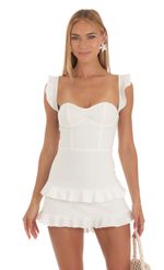Picture Ruffle Corset Dress in White. Source: https://media-img.lucyinthesky.com/data/May23/150xAUTO/f0076bf1-3933-4eb6-bede-3f8b33a8f850.jpg
