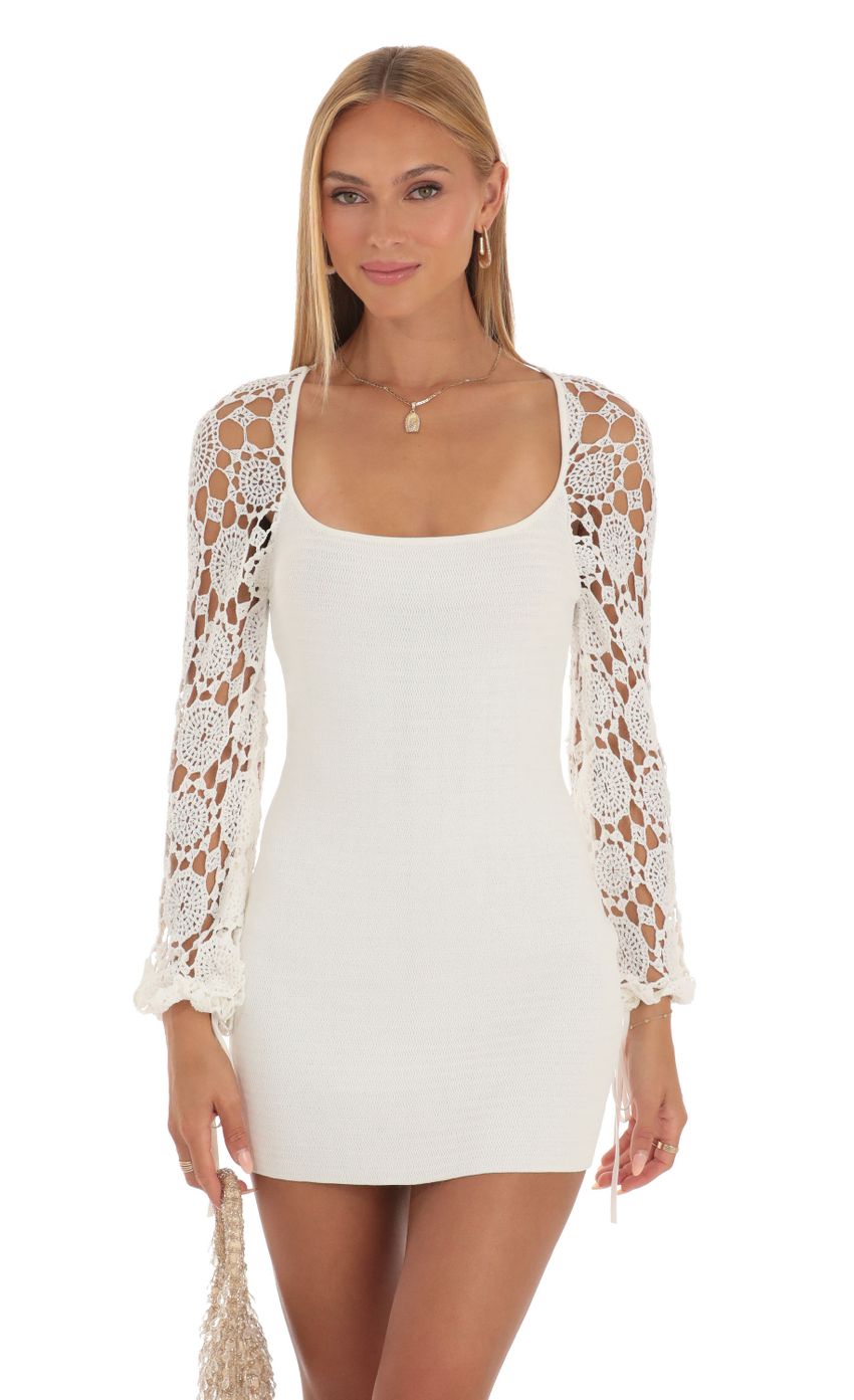 Picture Floral Crochet Long Sleeve Dress in White. Source: https://media-img.lucyinthesky.com/data/May23/850xAUTO/00e29936-390b-47b9-a355-fabe2c606812.jpg