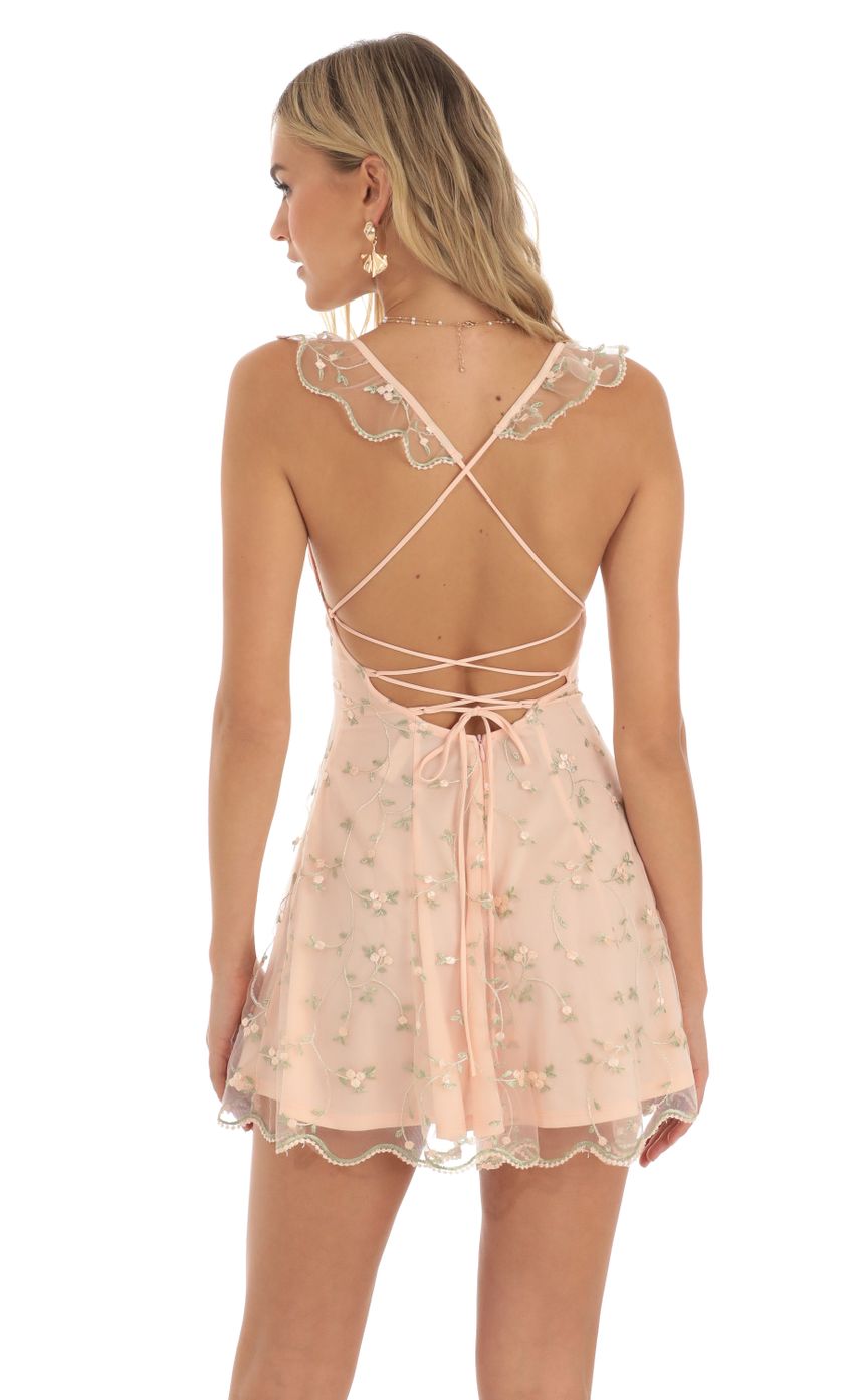 Picture Floral Embroidered Mini A-Line Dress in Peach. Source: https://media-img.lucyinthesky.com/data/May23/850xAUTO/1ccd4cfe-ec79-49aa-ba55-f2c954c7f5e1.jpg
