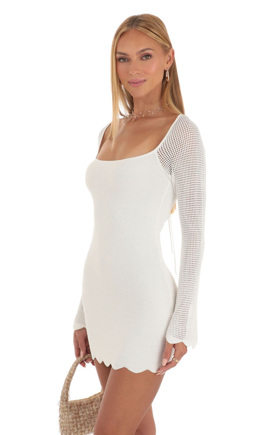 Picture Crochet Bell Sleeve Dress in White. Source: https://media-img.lucyinthesky.com/data/May23/850xAUTO/2609d0ad-799e-4035-a33d-c8505140821f.jpg