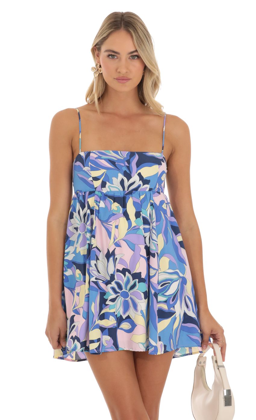 Picture Juno Floral Printed Baby Doll Dress in Blue. Source: https://media-img.lucyinthesky.com/data/May23/850xAUTO/2ca72ecb-7a33-4d0c-97d9-12b3dc95a895.jpg