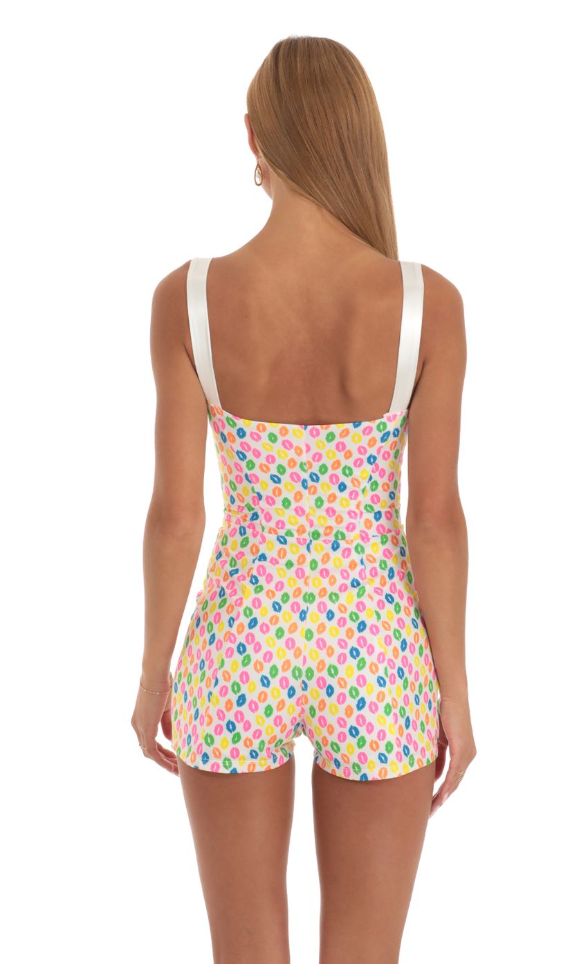 Picture Hook and Eye Romper in Multi Kiss Print. Source: https://media-img.lucyinthesky.com/data/May23/850xAUTO/36e64c37-23bc-496c-be59-a3bfc3ae7696.jpg