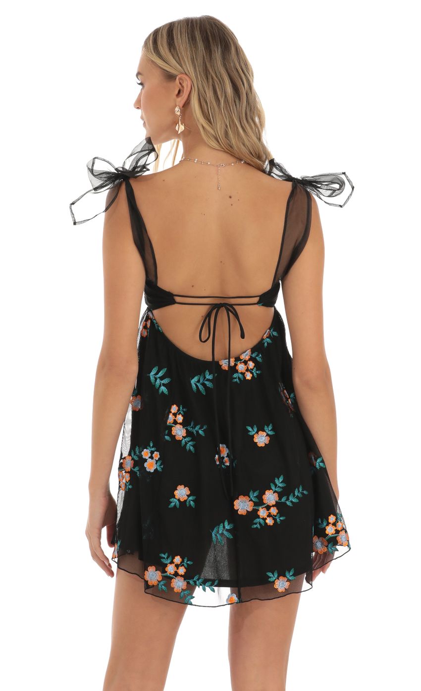 Picture Floral Embroidered Baby-Doll Dress in Black. Source: https://media-img.lucyinthesky.com/data/May23/850xAUTO/4a62c2fd-156e-40e1-a160-4635603457d3.jpg