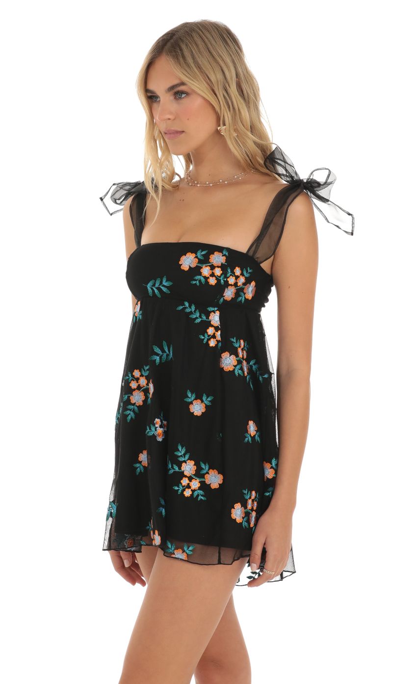 Picture Floral Embroidered Baby-Doll Dress in Black. Source: https://media-img.lucyinthesky.com/data/May23/850xAUTO/4da853f4-da12-4791-8c94-9758c20a5755.jpg