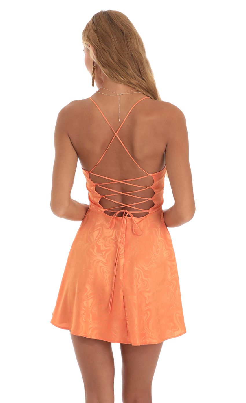 Picture Swirl A-Line Mini Dress in Orange. Source: https://media-img.lucyinthesky.com/data/May23/850xAUTO/52c6c677-3fe0-43c8-a0c9-11fe0d97d913.jpg