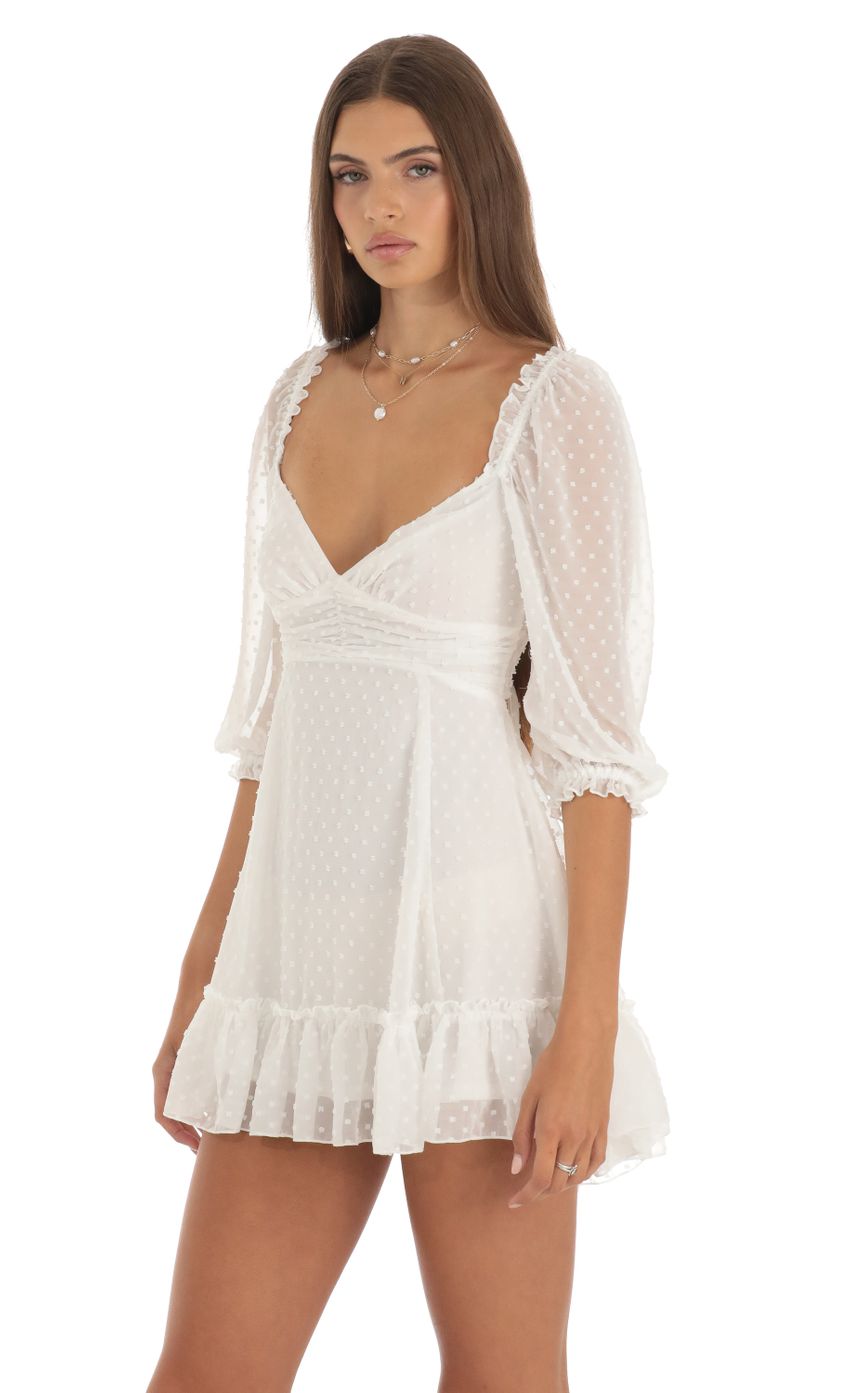 Picture Chiffon Dotted A-Line Mini Dress in White. Source: https://media-img.lucyinthesky.com/data/May23/850xAUTO/60d349b6-9b06-40cd-8229-f036a2f17549.jpg