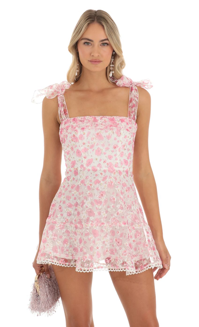Picture Shimmer Pink Floral Mini Dress in White. Source: https://media-img.lucyinthesky.com/data/May23/850xAUTO/6852adb3-7fef-4c70-a25b-6553d871db1a.jpg