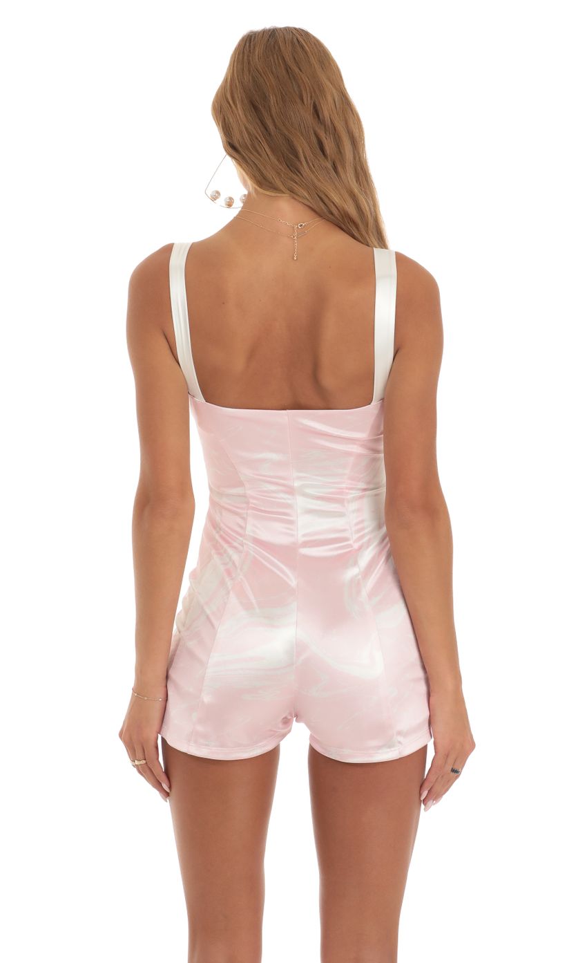 Picture Hook and Eye Romper in Pink Swirl. Source: https://media-img.lucyinthesky.com/data/May23/850xAUTO/71f5d2ba-9b72-4580-b992-b492cd2850ac.jpg