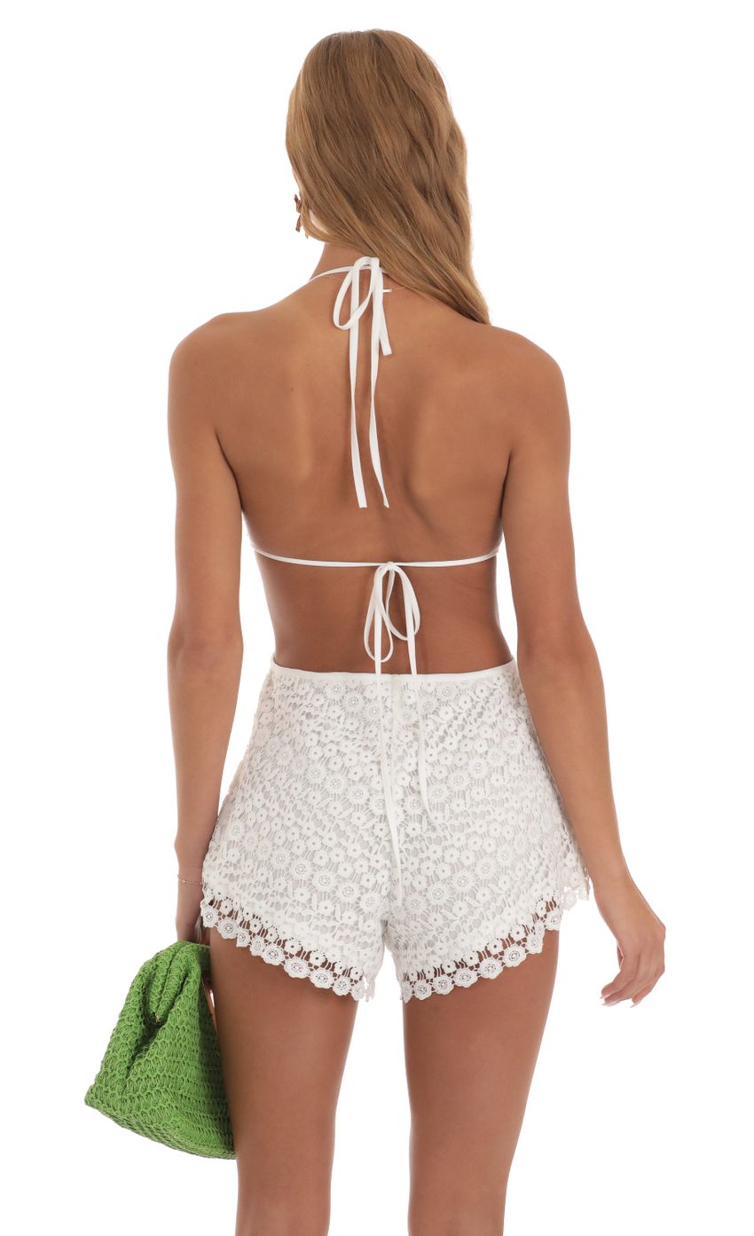 Picture Cutout Crochet Romper in White. Source: https://media-img.lucyinthesky.com/data/May23/850xAUTO/739f5c29-c452-4b8c-aef4-688cf928a46c.jpg