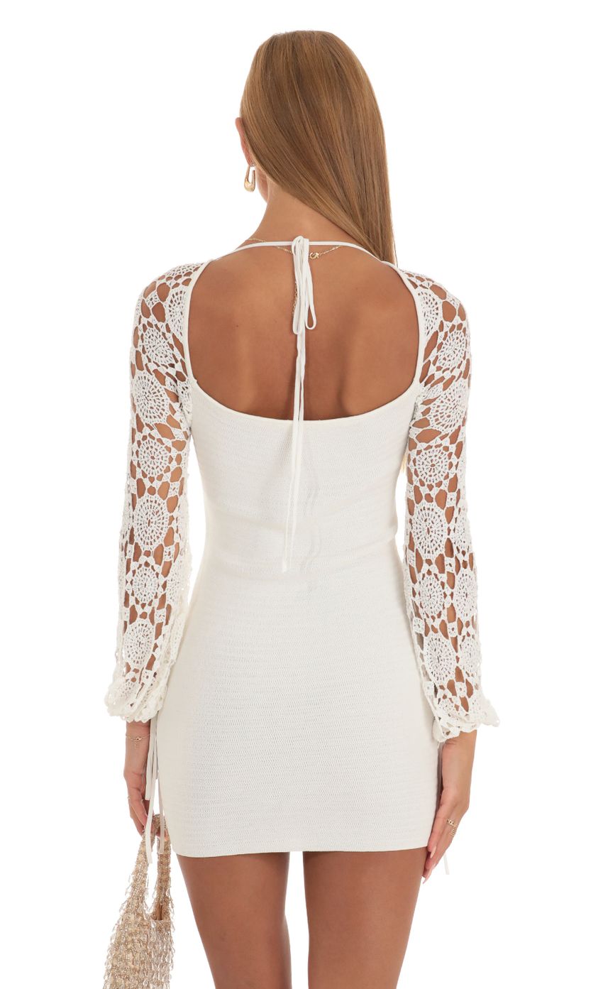 Picture Floral Crochet Long Sleeve Dress in White. Source: https://media-img.lucyinthesky.com/data/May23/850xAUTO/79fabd2f-65a9-4867-bf57-2930a67ec2c2.jpg