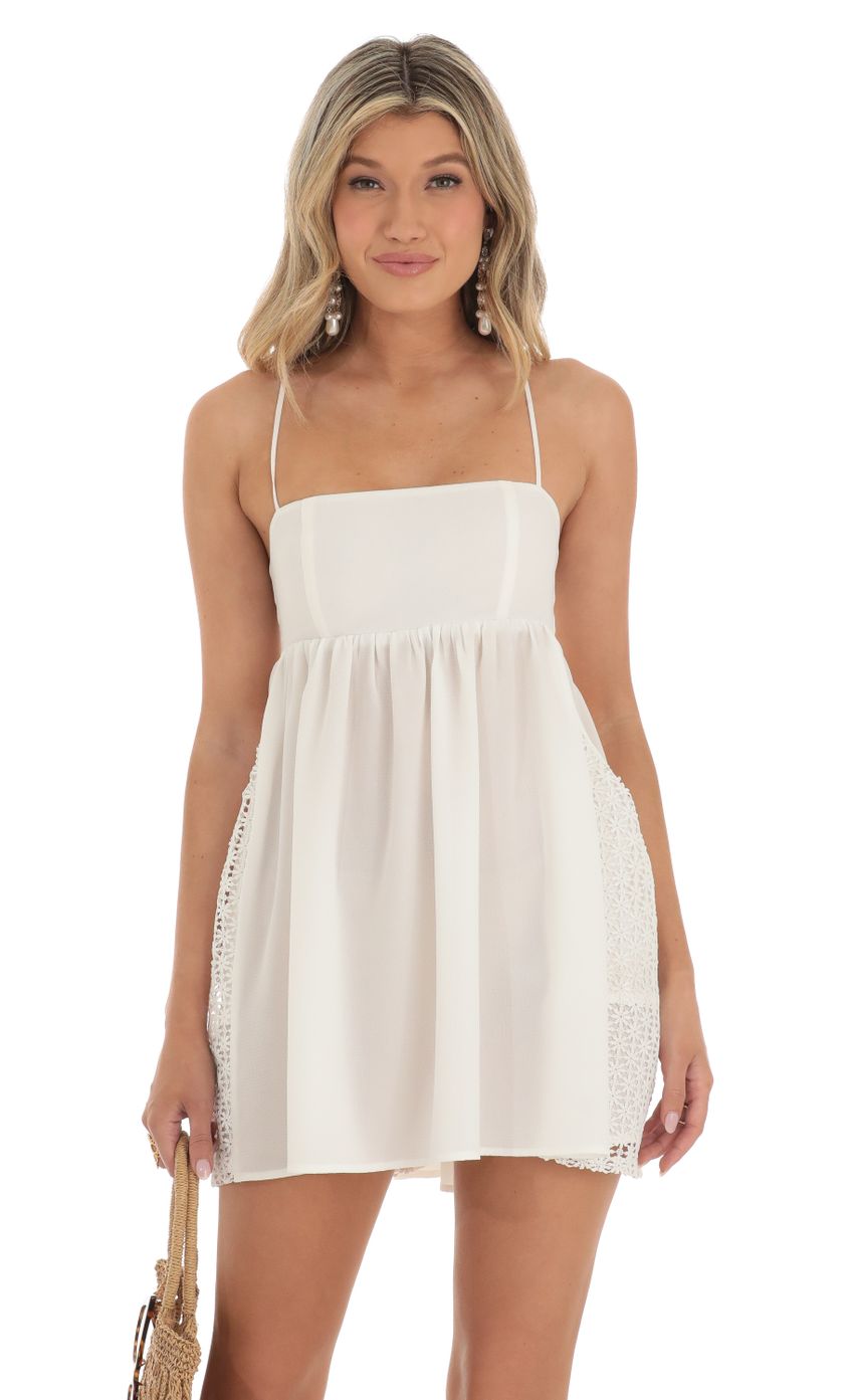 Picture Babydoll Dress in White with Crochet. Source: https://media-img.lucyinthesky.com/data/May23/850xAUTO/9c13adf8-e0d4-445c-a675-86757d30add8.jpg