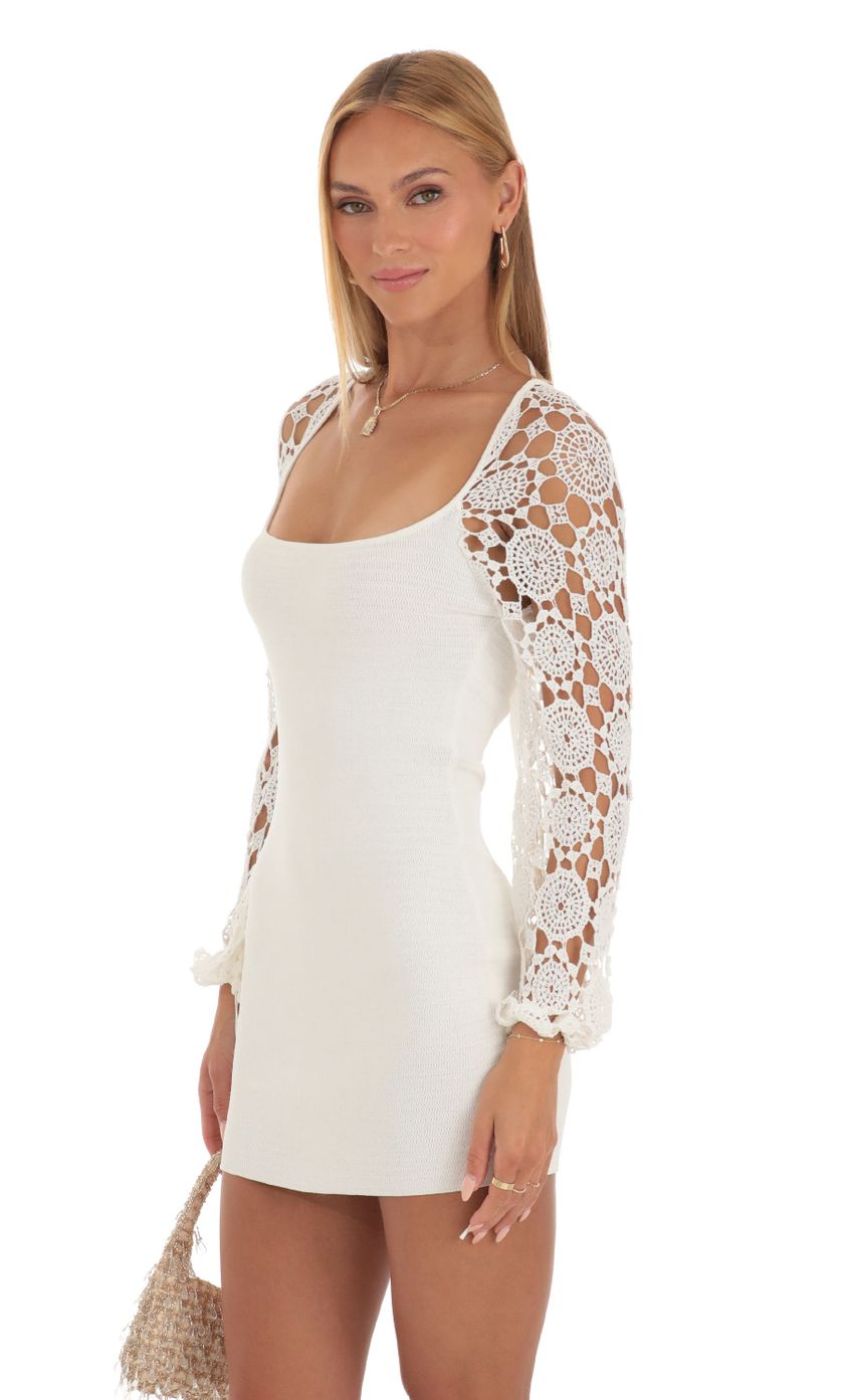 Picture Floral Crochet Long Sleeve Dress in White. Source: https://media-img.lucyinthesky.com/data/May23/850xAUTO/b8834d1e-abff-45ab-a724-6563b8b843ea.jpg