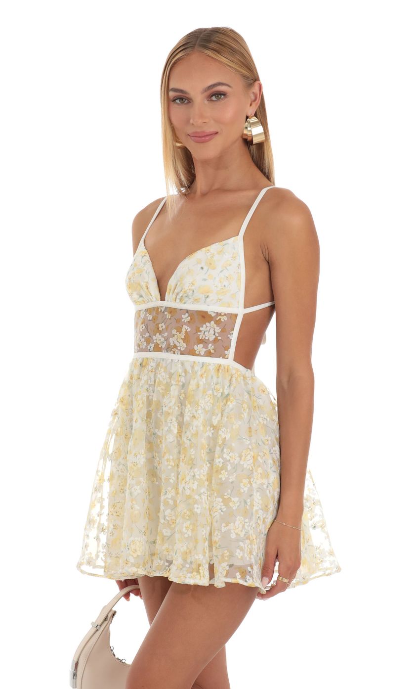 Picture Shimmer Floral Mini Dress in Yellow. Source: https://media-img.lucyinthesky.com/data/May23/850xAUTO/c8748090-e6a4-4a75-a468-8b9605793be4.jpg