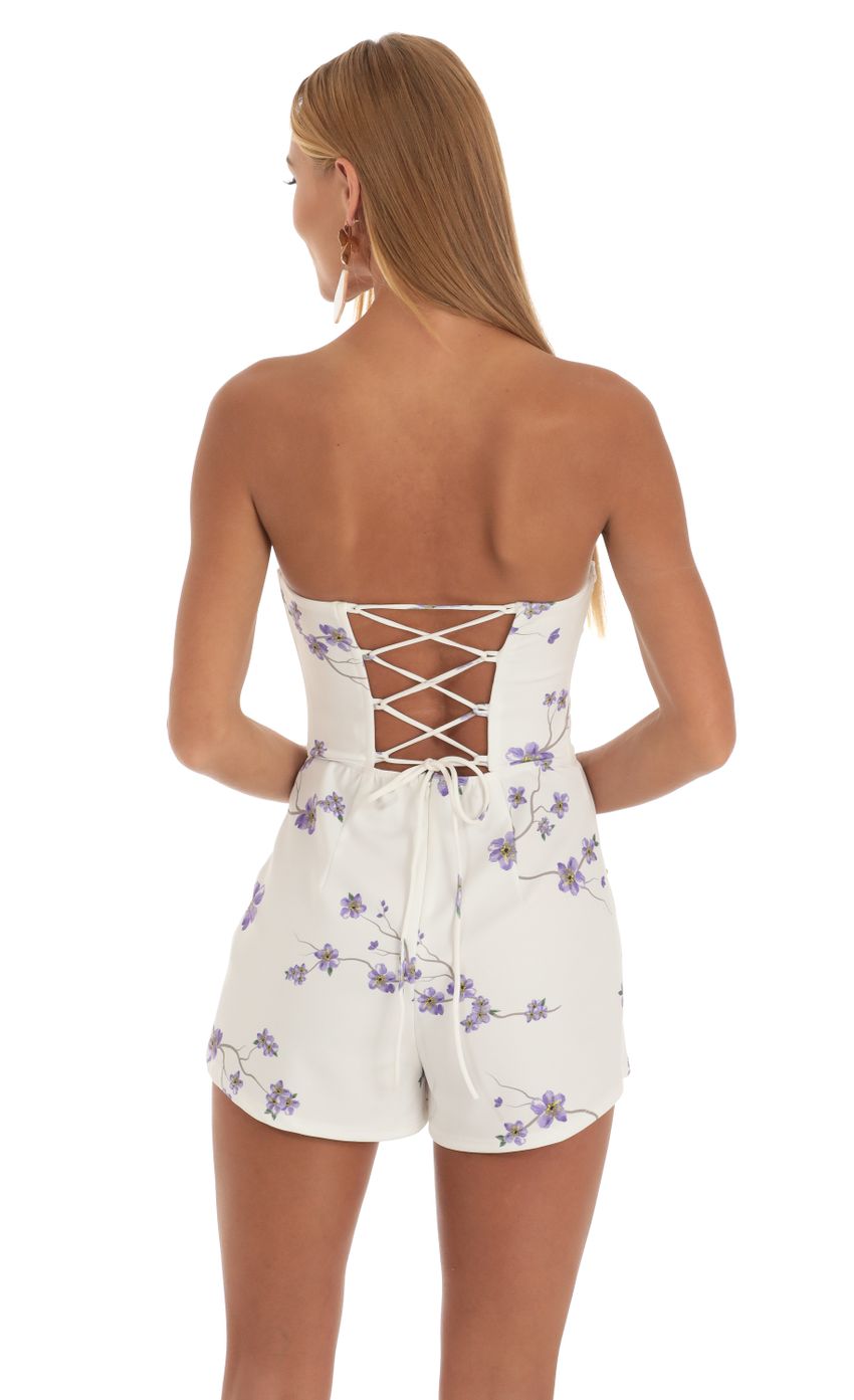 Picture Purple Sakura Print Strapless Romper in White. Source: https://media-img.lucyinthesky.com/data/May23/850xAUTO/f4811c69-a23a-4e5c-be54-8392597bcee6.jpg