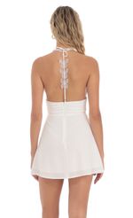 Picture Butterfly Strap Halter Dress in White. Source: https://media-img.lucyinthesky.com/data/May24/150xAUTO/53391679-bd0e-4bc3-b0b6-b147f6416f53.jpg