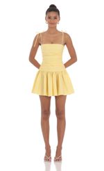 Picture Ruched Fit and Flare Dress in Yellow. Source: https://media-img.lucyinthesky.com/data/May24/150xAUTO/652f705a-c8d6-41b7-b856-bde92c926d3a.jpg