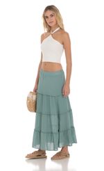 Picture Flowy Maxi Skirt in Sage Blue. Source: https://media-img.lucyinthesky.com/data/May24/150xAUTO/72b8428e-e106-4fb1-85fc-f3cb1d7ea04a.jpg