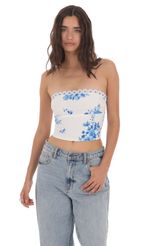 Picture Strapless Floral Top in White. Source: https://media-img.lucyinthesky.com/data/May24/150xAUTO/7f878829-71a6-4564-9e71-e7eeb10d454e.jpg