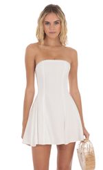 Picture Dotted Strapless Dress in White. Source: https://media-img.lucyinthesky.com/data/May24/150xAUTO/d2e04922-0d4b-4f7f-a240-9af6274a02e9.jpg