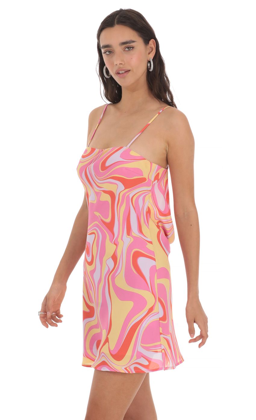 Picture Swirl Open Back Dress in Pink. Source: https://media-img.lucyinthesky.com/data/May24/850xAUTO/032dd315-c061-45b6-8177-5504fc82b689.jpg
