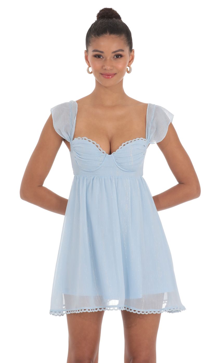 Picture Shimmer Embroidered Trim Babydoll Dress in Blue. Source: https://media-img.lucyinthesky.com/data/May24/850xAUTO/15ecb4b1-31e3-4126-b60b-9450254a839d.jpg
