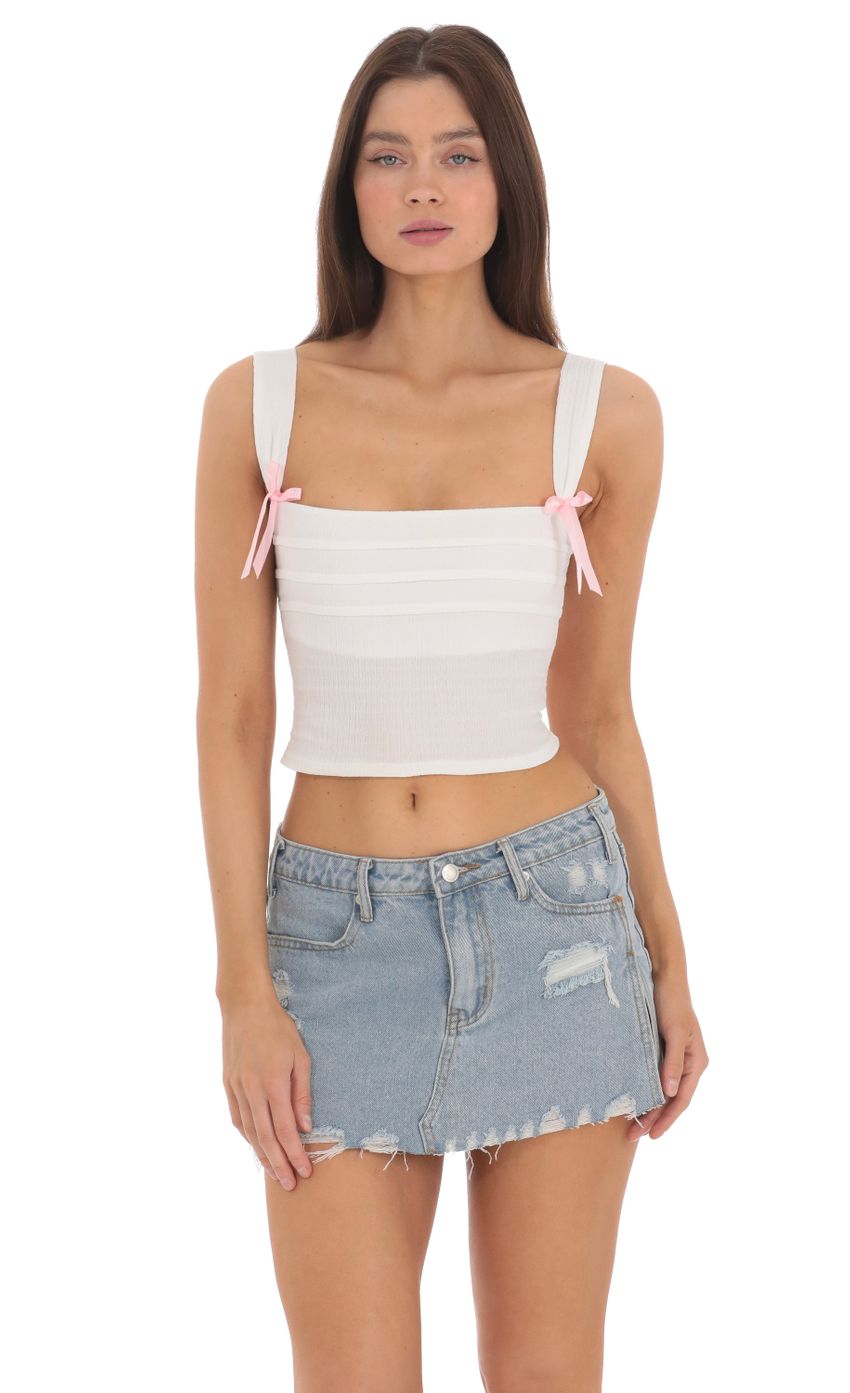 Picture Double Pink Bows Top in White. Source: https://media-img.lucyinthesky.com/data/May24/850xAUTO/27e9975f-66b9-403e-86b7-a08b54c077dd.jpg