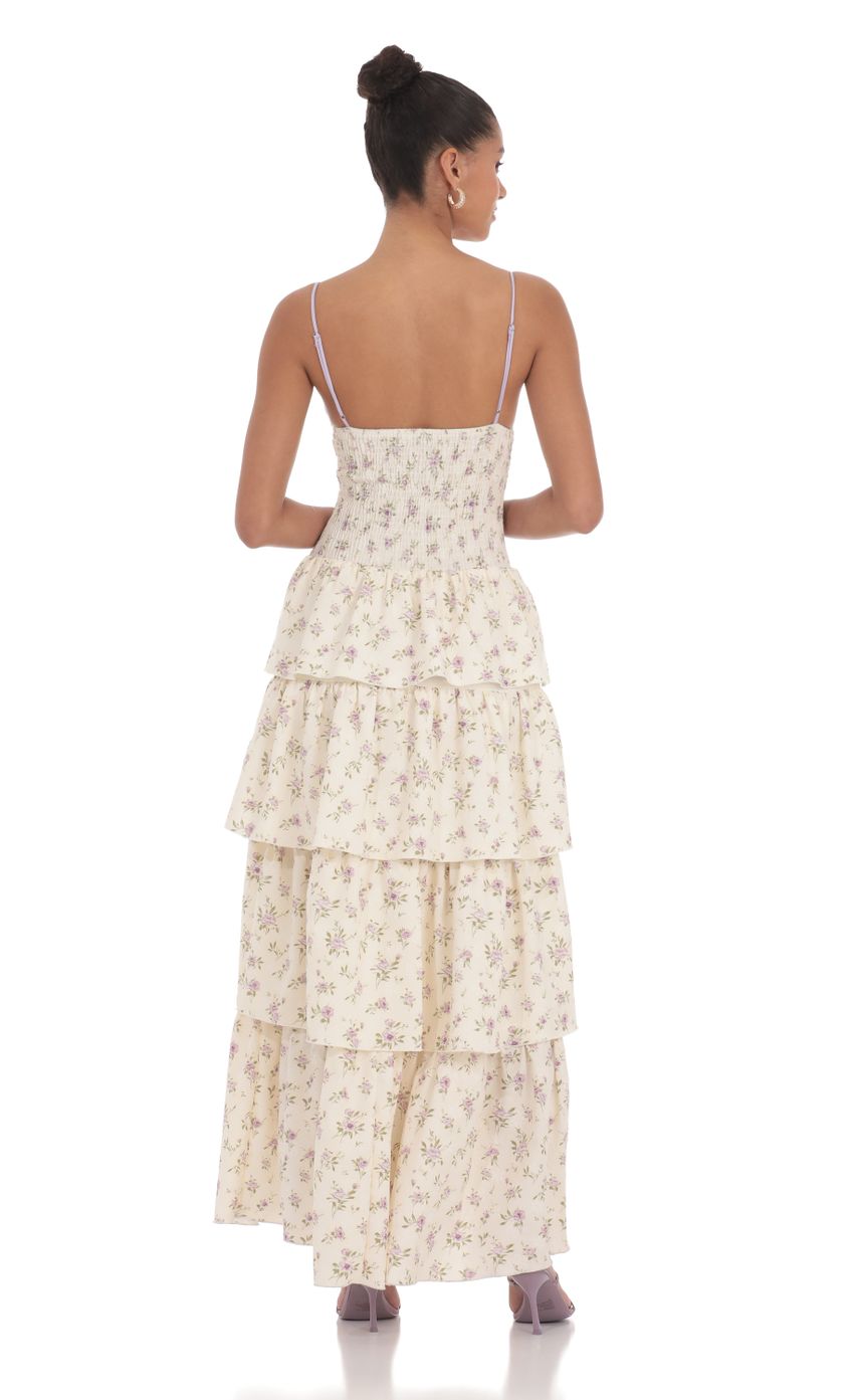 Picture Floral Cutout Ruffle Maxi Dress in Cream. Source: https://media-img.lucyinthesky.com/data/May24/850xAUTO/32f317a3-004e-41b6-b0f7-14de4f5a3ff2.jpg