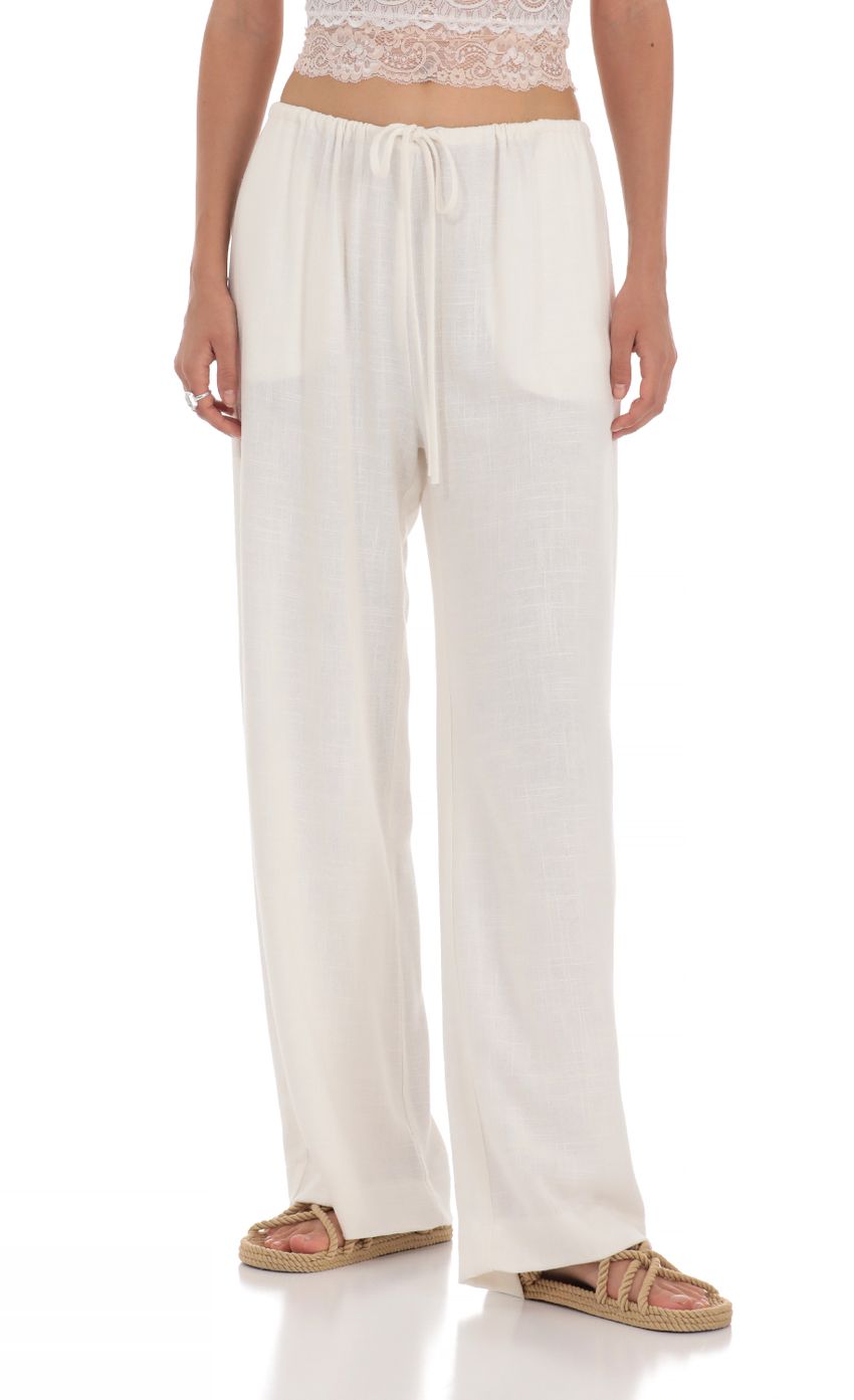 Picture Linen Drawstring Pants in Cream. Source: https://media-img.lucyinthesky.com/data/May24/850xAUTO/5c917495-64da-44a3-a22d-62a088335e7e.jpg