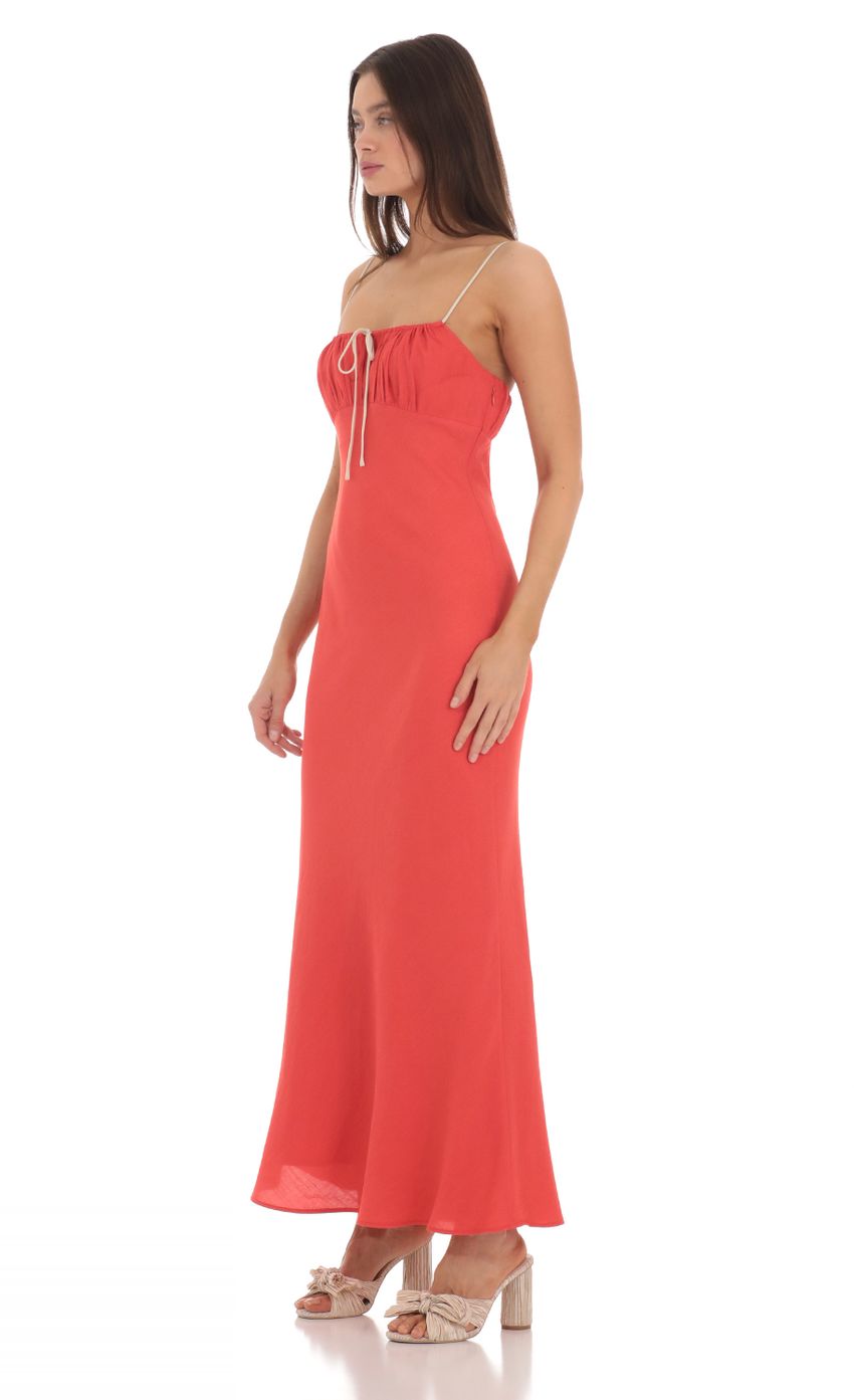 Picture Front Tie Maxi Dress in Coral Red. Source: https://media-img.lucyinthesky.com/data/May24/850xAUTO/5de1f004-ccc4-463b-9fd9-d0fe261bc9e5.jpg