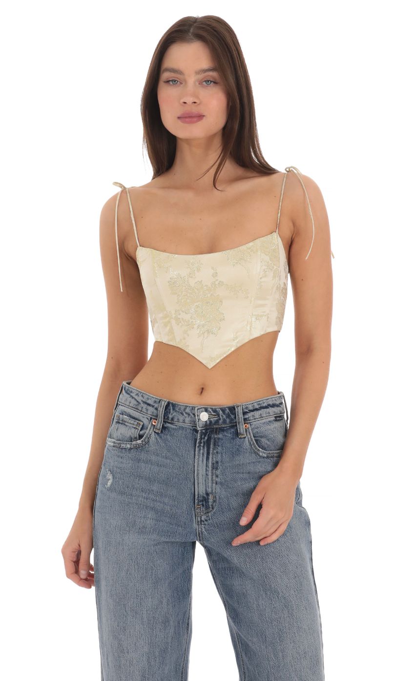 Picture Shimmer Floral Corset Top in Gold. Source: https://media-img.lucyinthesky.com/data/May24/850xAUTO/63bfe979-4053-44f0-978e-548117eaba91.jpg