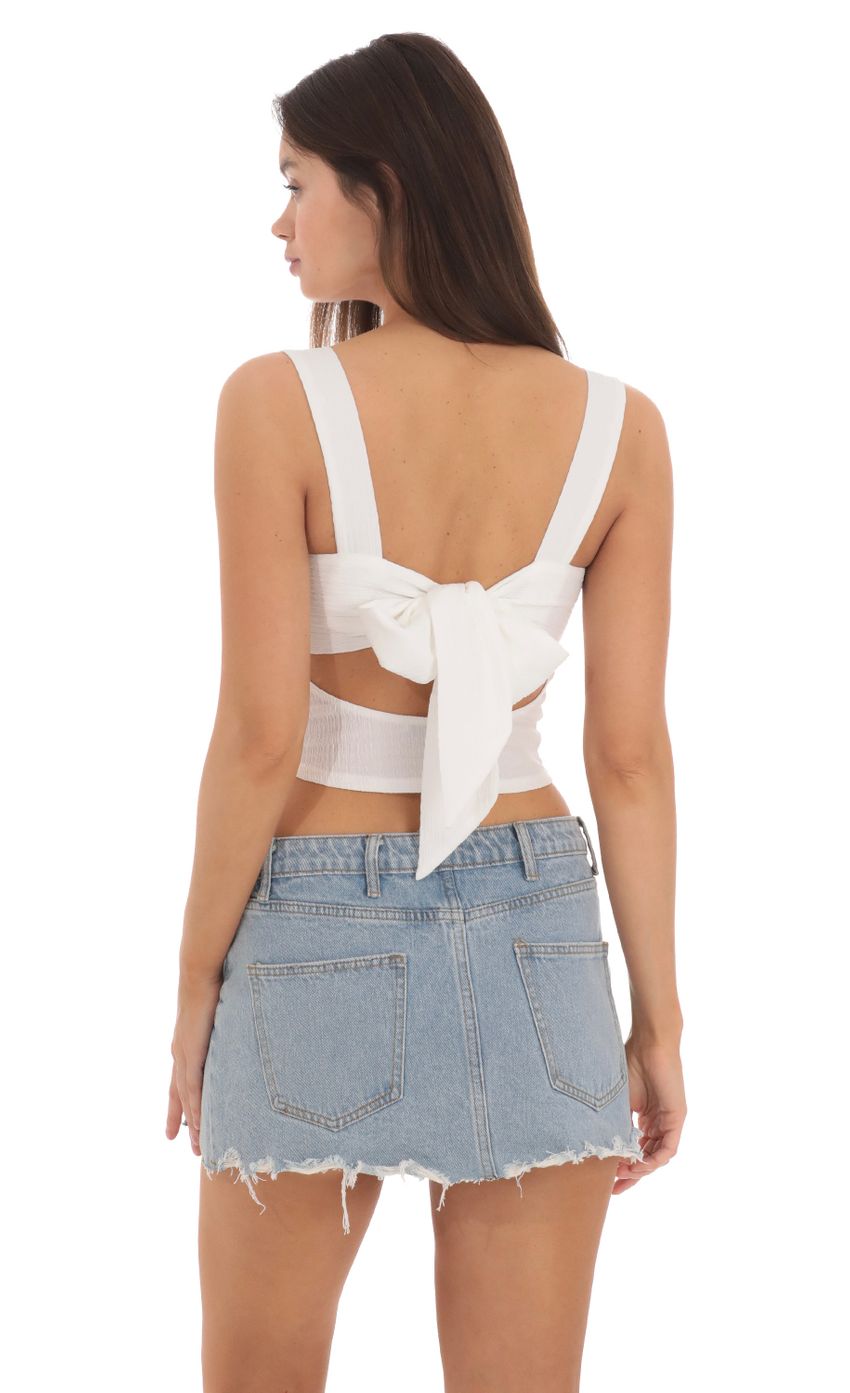 Picture Double Pink Bows Top in White. Source: https://media-img.lucyinthesky.com/data/May24/850xAUTO/6511bfa4-e439-432b-b4f7-67531002dd17.jpg