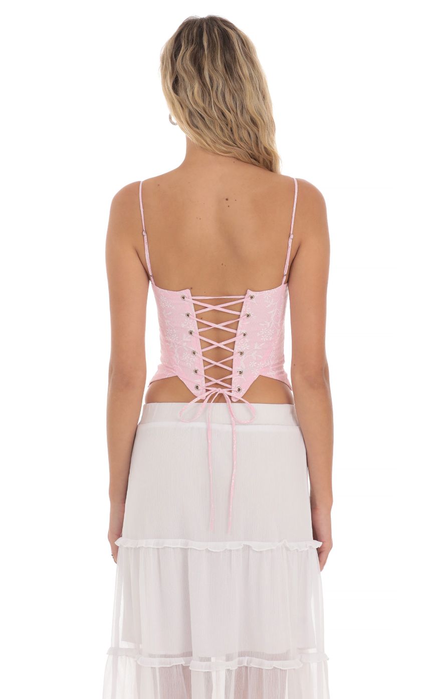 Picture Striped Floral Corset Top in Pink. Source: https://media-img.lucyinthesky.com/data/May24/850xAUTO/881795a6-0501-406c-9dd7-1ec4a6bde826.jpg